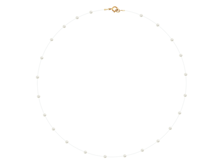Leonore - Tiny Pearl Necklace on Clear Thread