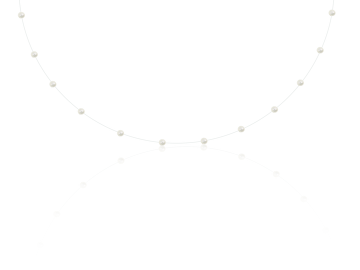 Leonore - Tiny Pearl Necklace on Clear Thread
